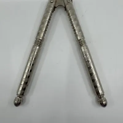 Vintage HMQ nutcracker, a tool designed for cracking nuts.